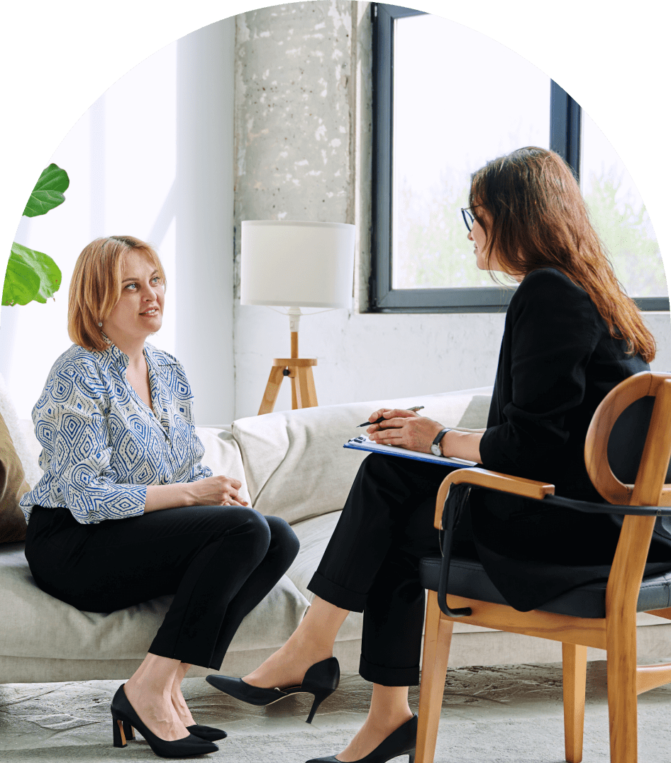 Woman attentively listening in a group discussion.